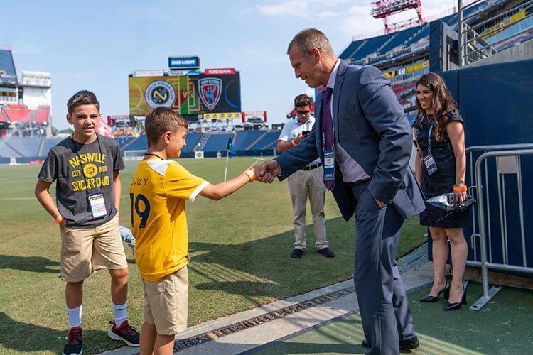 Nashville Soccer Club coach interacts with young fans