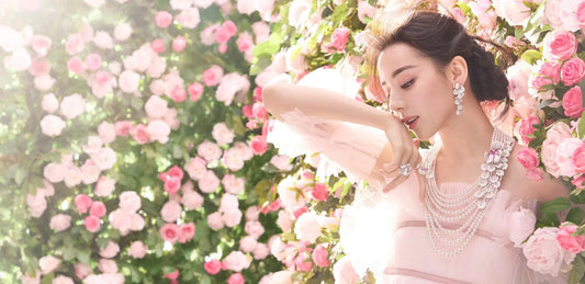 Model wearing Mikimoto pearls