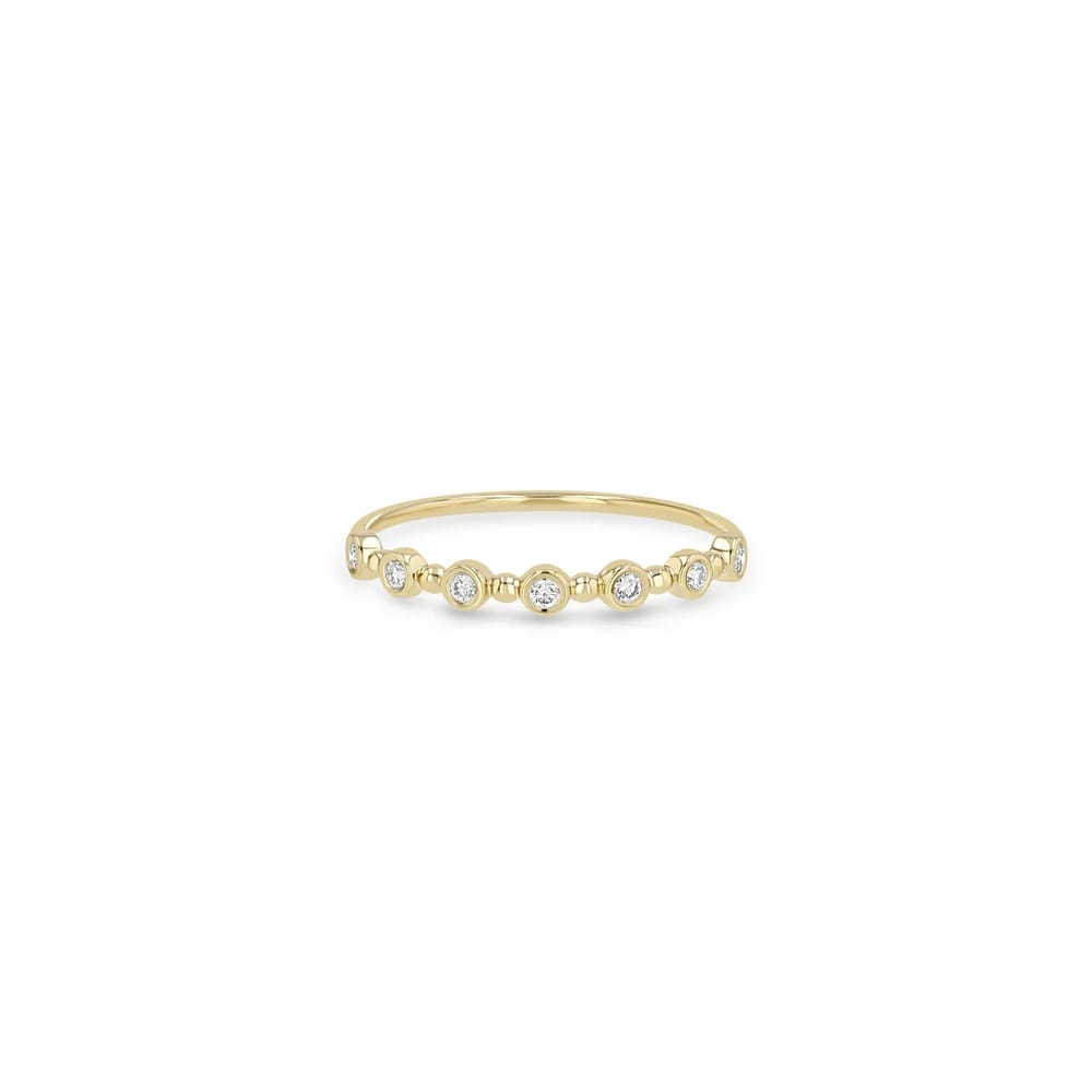 14K GOLD BEAD AND ROUND BEZEL RING WITH 7 1.5MM WHITE DIAMONDS ACROSS THE TOP (.11 CTW)
