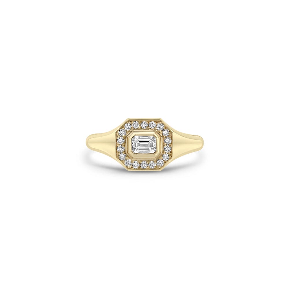 14K GOLD HORIZONTAL EMERALD CUT HALO SIGNET RING WITH AN EMERALD CUT DIAMOND IN THE MIDDLE FRAMED BY WHITE PAVÉ