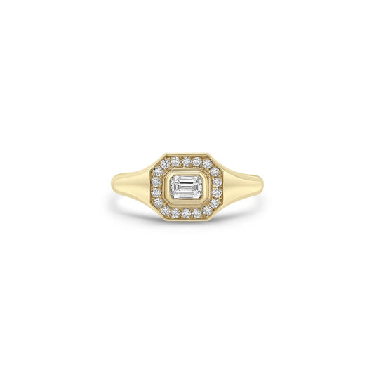 14K GOLD HORIZONTAL EMERALD CUT HALO SIGNET RING WITH AN EMERALD CUT DIAMOND IN THE MIDDLE FRAMED BY WHITE PAVÉ