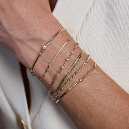 14K GOLD 4 PRONG DASH BRACELET WITH PRONG SET 2MM WHITE DIAMONDS WITH A 6-7" ADJUSTABLE SMALL ROLO CHAIN (.15 CTW)