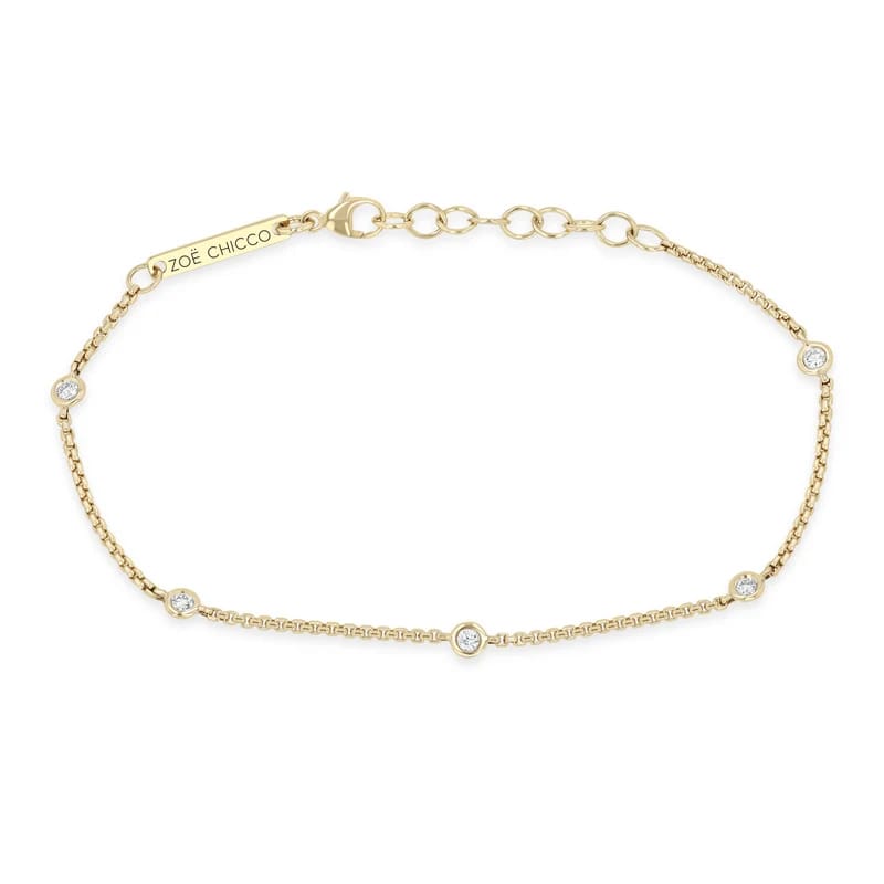 14K GOLD BRACELET WITH 5 2MM FLOATING DIAMONDS STATIONED IN A X-SMALL BOX CHAIN WITH A 6-7" ADJUSTABLE LENGTH (.15 CTW)