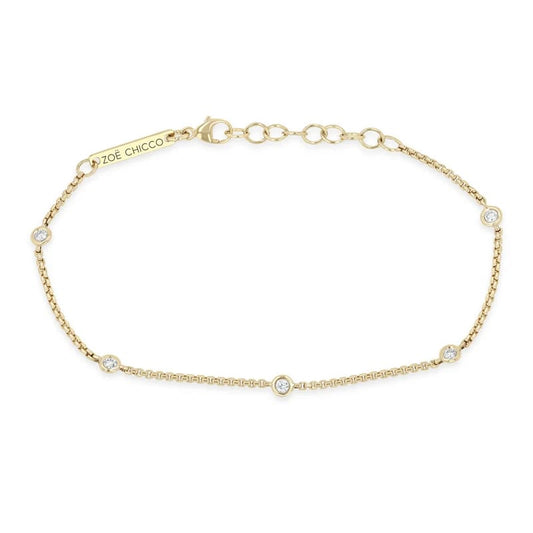 14K GOLD BRACELET WITH 5 2MM FLOATING DIAMONDS STATIONED IN A X-SMALL BOX CHAIN WITH A 6-7" ADJUSTABLE LENGTH (.15 CTW)