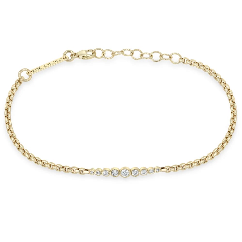 14K GOLD GRADUATED BEZELS BRACELET OF MIXED WHITE DIAMONDS ON AN ADJUSTABLE 6-7" SMALL BOX CHAIN (.18 CTW)