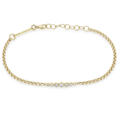 14K GOLD GRADUATED BEZELS BRACELET OF MIXED WHITE DIAMONDS ON AN ADJUSTABLE 6-7" SMALL BOX CHAIN (.18 CTW)