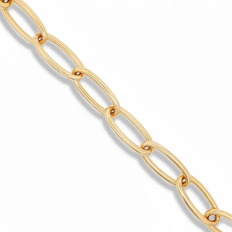 A close-up of a gold chain with elongated oval links, shown diagonally against a clean white background.
