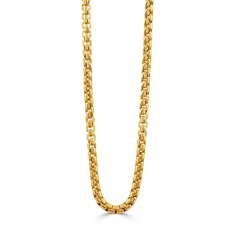 A gold-toned metal chain necklace with a curb-style link pattern, shown hanging vertically against a plain white background.