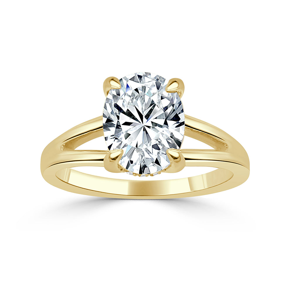 split shank engagement ring in yellow gold with oval center diamond